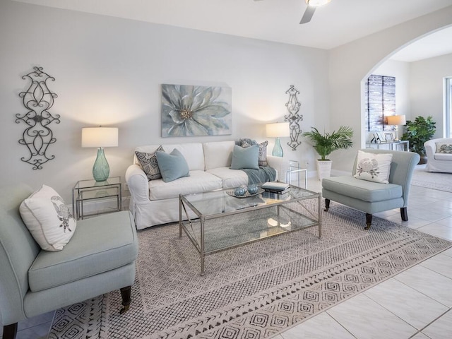 living room with tile patterned floors and ceiling fan