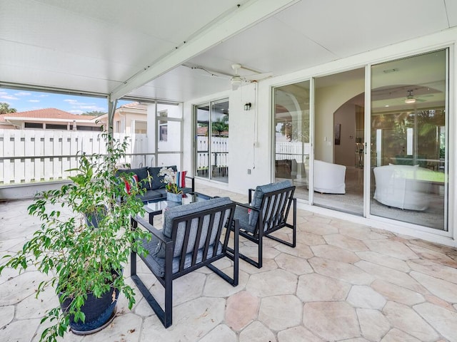 view of patio with outdoor lounge area and ceiling fan