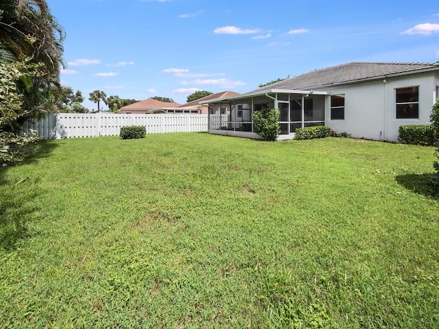 view of yard featuring a sunroom