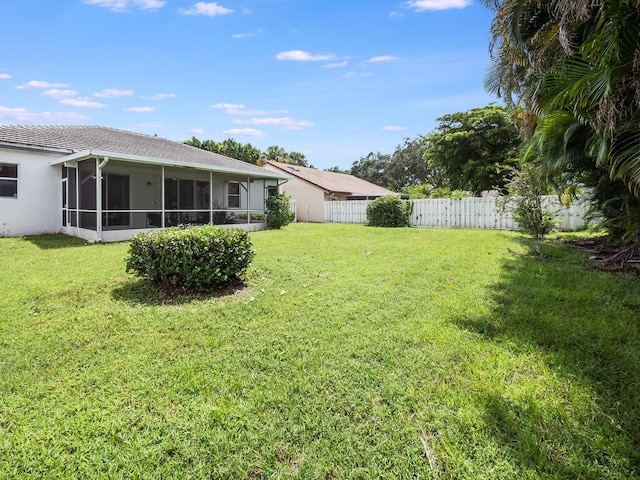 view of yard with a sunroom