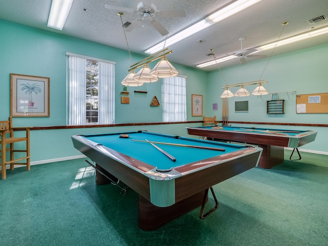 recreation room with a textured ceiling, carpet floors, ceiling fan, and pool table