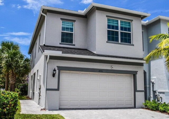 view of front of property with a garage