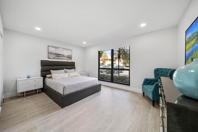 bedroom with light hardwood / wood-style floors