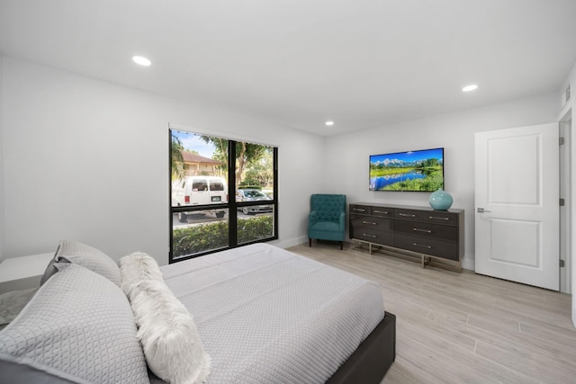 bedroom with light hardwood / wood-style floors