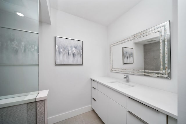 bathroom with tile patterned flooring and vanity