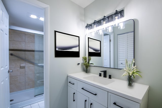 bathroom with vanity, tile patterned floors, and an enclosed shower