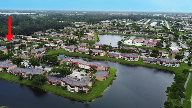 bird's eye view featuring a residential view and a water view