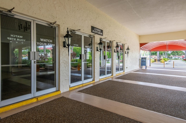 doorway to property with stucco siding