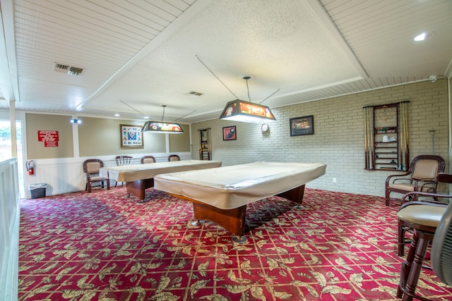 rec room with pool table and brick wall