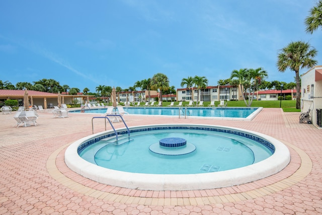 view of swimming pool with a patio