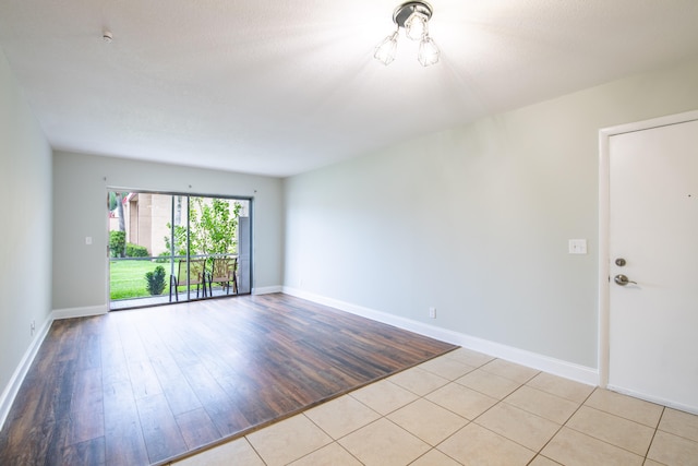 spare room featuring light hardwood / wood-style floors