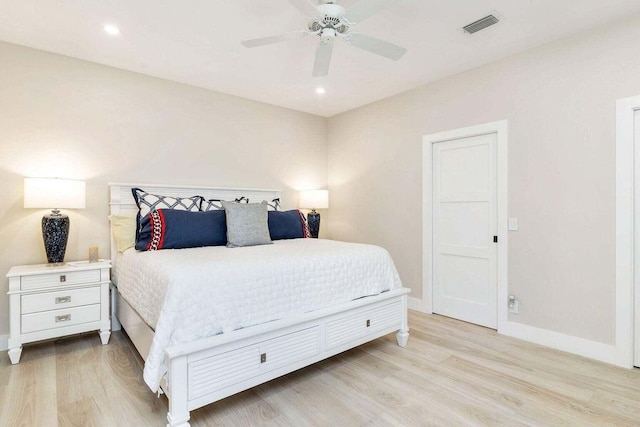 bedroom with ceiling fan and light wood-type flooring