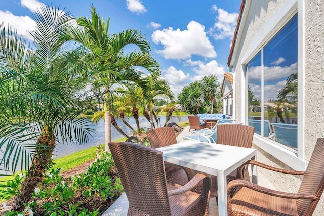 view of patio with a water view