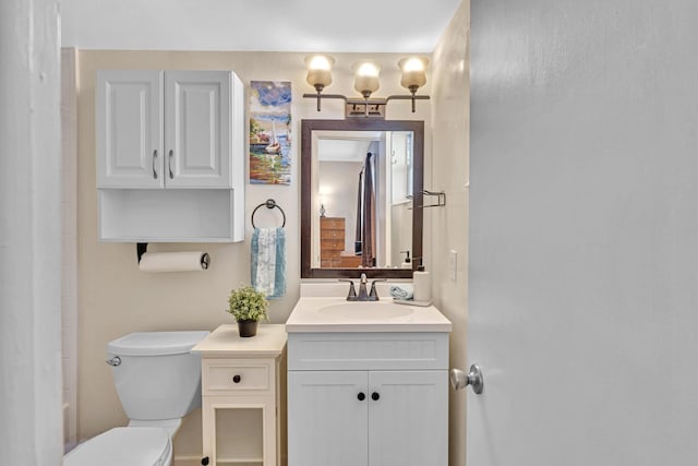 bathroom featuring vanity and toilet