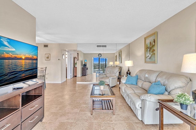 living room with a textured ceiling