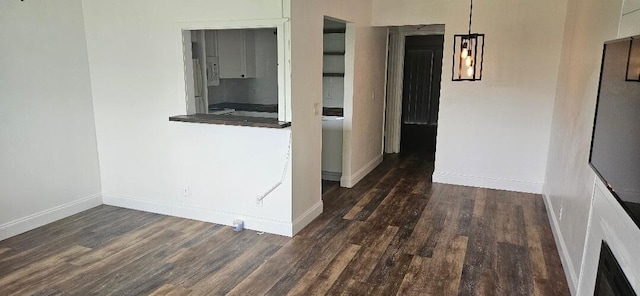 corridor with dark hardwood / wood-style floors