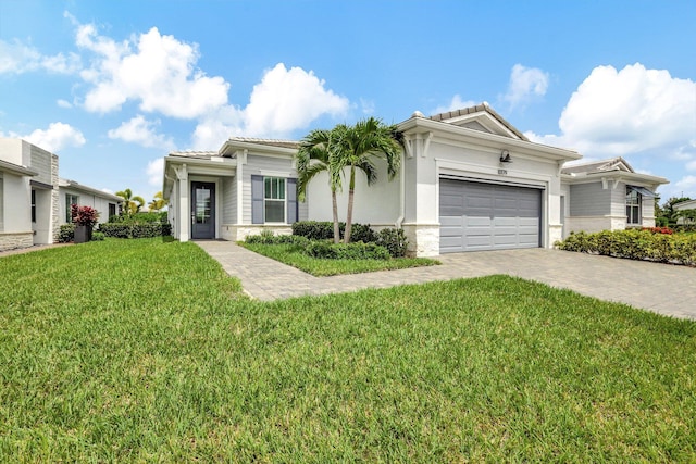 view of front facade with a front lawn and a garage