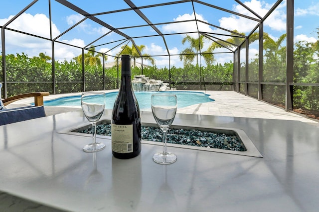 view of pool featuring a lanai and a patio area