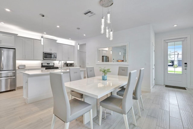 dining space featuring light hardwood / wood-style flooring