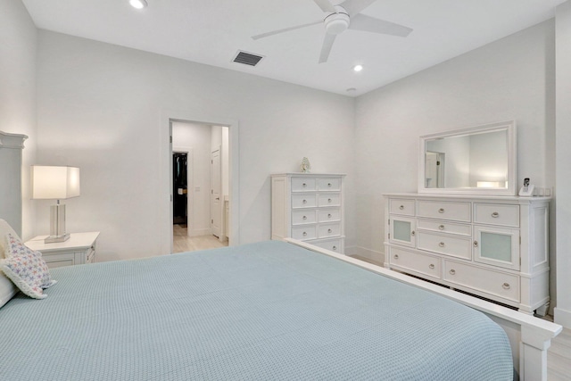 bedroom with ceiling fan and light hardwood / wood-style flooring