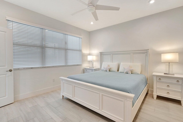 bedroom with light hardwood / wood-style floors and ceiling fan