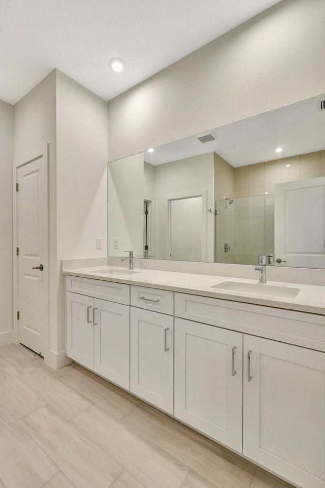 bathroom with vanity and an enclosed shower