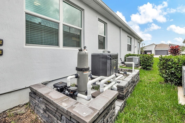 exterior space featuring central AC unit