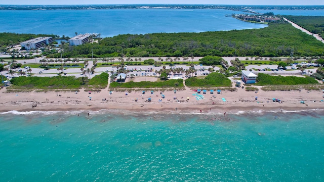 bird's eye view with a water view and a view of the beach