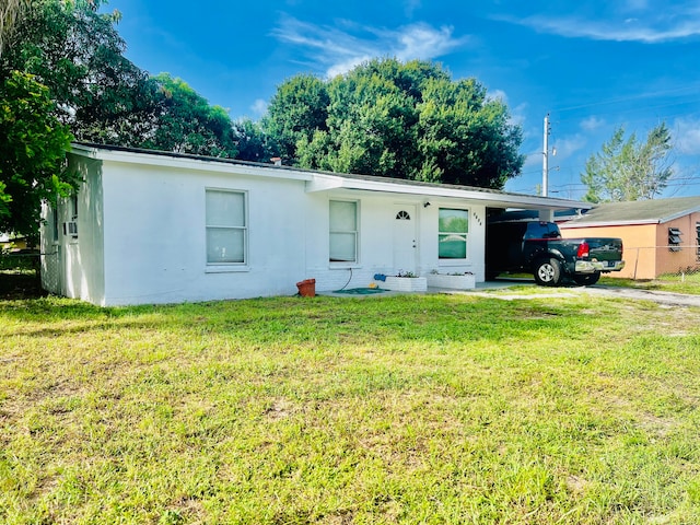 single story home with a front yard