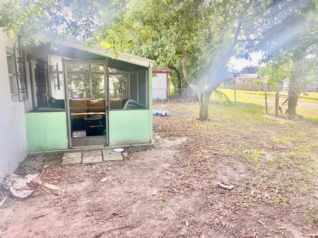 view of yard featuring a sunroom