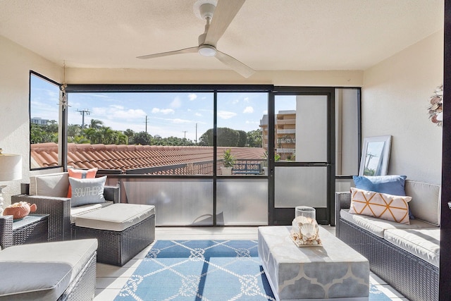 sunroom featuring ceiling fan