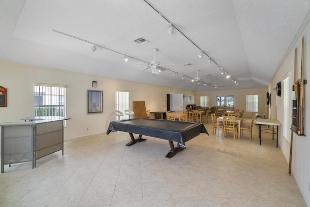 recreation room featuring pool table, visible vents, a ceiling fan, vaulted ceiling, and a textured ceiling