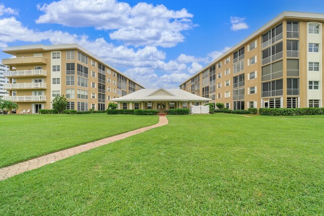 view of community featuring a lawn