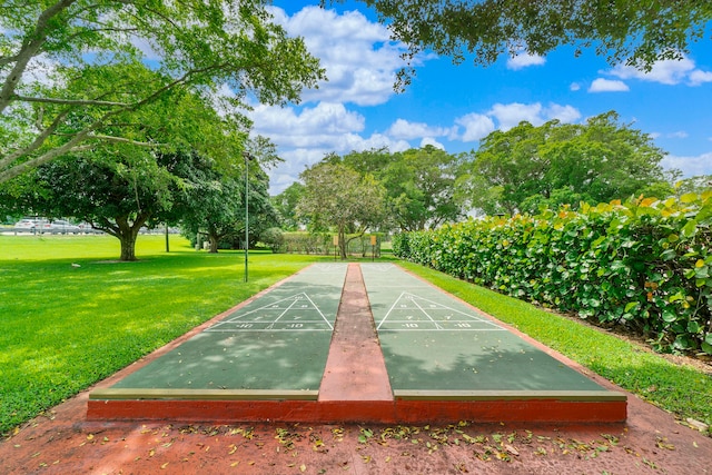 view of property's community featuring a yard