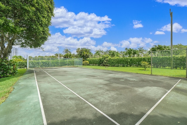 view of sport court with fence