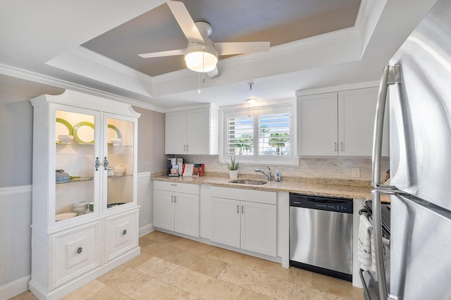 kitchen featuring appliances with stainless steel finishes, white cabinets, and decorative backsplash