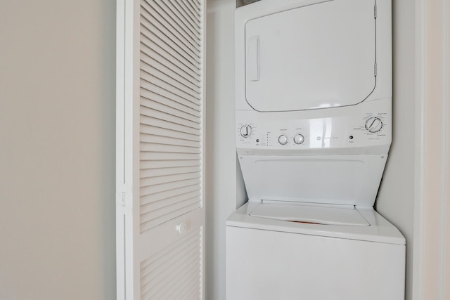 laundry area with stacked washer and dryer