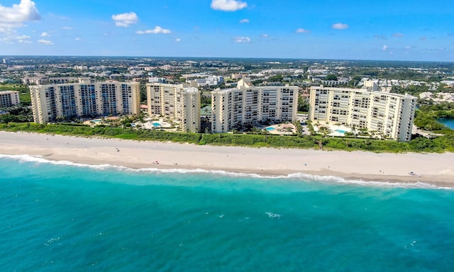 birds eye view of property featuring a view of the beach and a water view