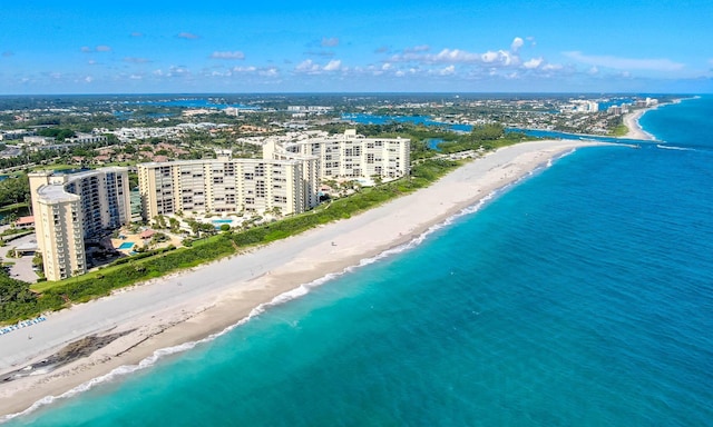 aerial view with a water view and a view of the beach