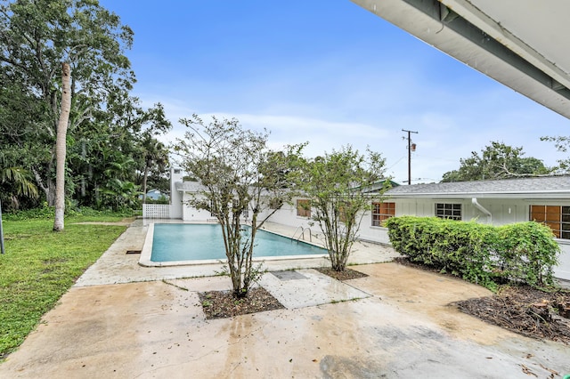 4050 Greenwood Dr, Fort Pierce, FL 34982 - outdoor pool featuring a lawn and a patio area