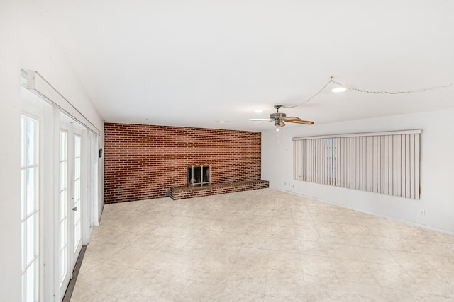 4050 Greenwood Dr, Fort Pierce, FL 34982 - unfurnished living room featuring light floors, ceiling fan, and brick wall