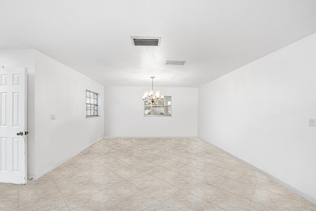 4050 Greenwood Dr, Fort Pierce, FL 34982 - unfurnished room featuring an inviting chandelier and visible vents