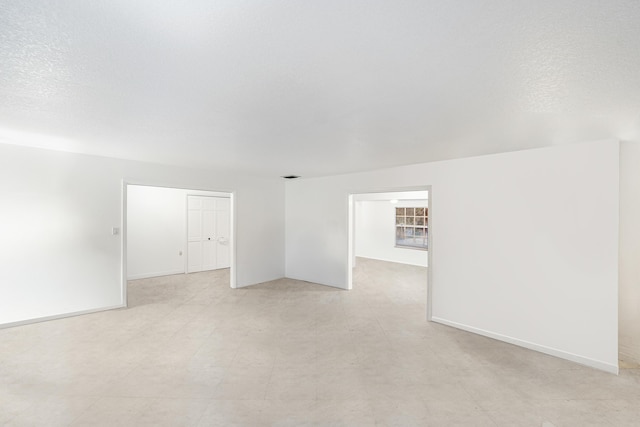 4050 Greenwood Dr, Fort Pierce, FL 34982 - empty room featuring baseboards, visible vents, light floors, and a textured ceiling