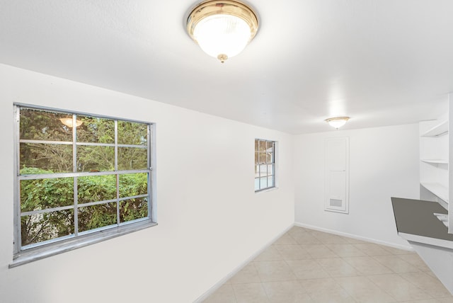4050 Greenwood Dr, Fort Pierce, FL 34982 - empty room with baseboards, visible vents, and light tile patterned floors