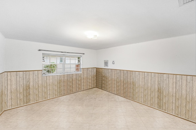 4050 Greenwood Dr, Fort Pierce, FL 34982 - unfurnished room featuring visible vents, wooden walls, and wainscoting