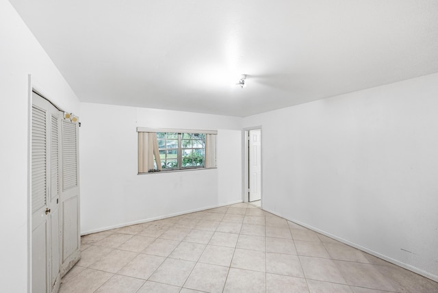 4050 Greenwood Dr, Fort Pierce, FL 34982 - unfurnished bedroom featuring baseboards and a closet