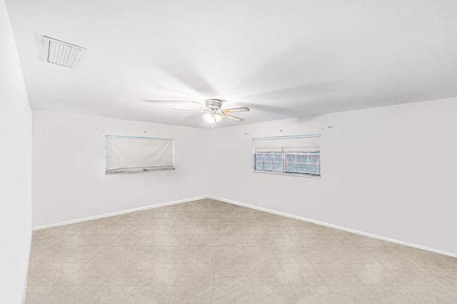 4050 Greenwood Dr, Fort Pierce, FL 34982 - empty room with baseboards, ceiling fan, and visible vents