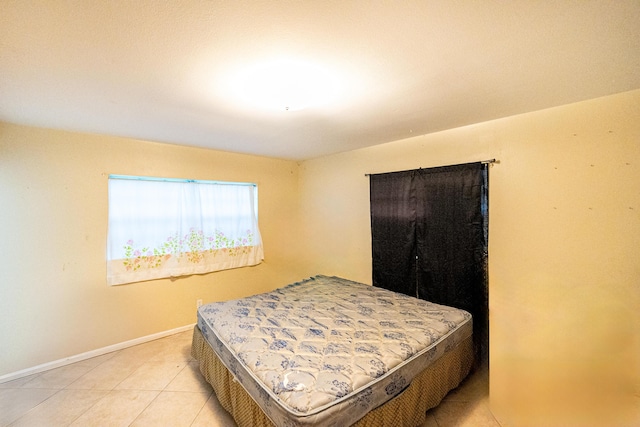 4050 Greenwood Dr, Fort Pierce, FL 34982 - bedroom with light tile patterned flooring and baseboards