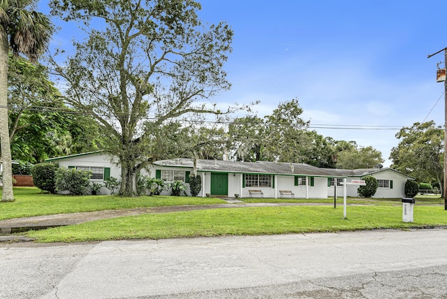 4050 Greenwood Dr, Fort Pierce, FL 34982 - view of front of property with driveway and a front yard