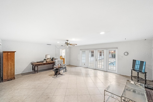 4050 Greenwood Dr, Fort Pierce, FL 34982 - sitting room with plenty of natural light, light tile patterned floors, french doors, and a ceiling fan